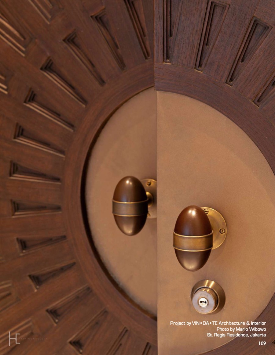 Carved timber door with solid brass knobs