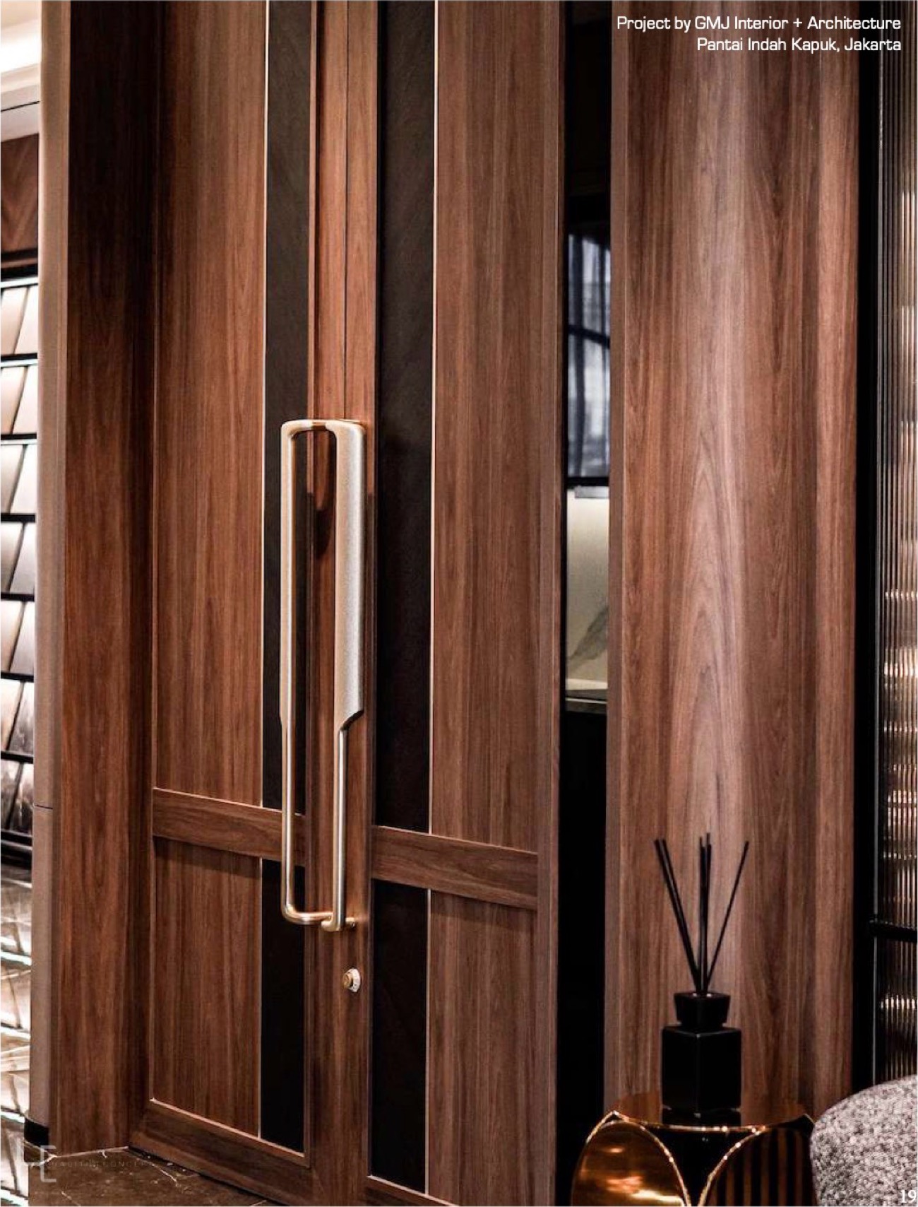 Dark timber double doors with a full height pull handle